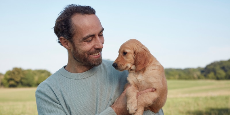 James Middleton holding Bertie the guide dog puppy he donated to Guide dogs UK