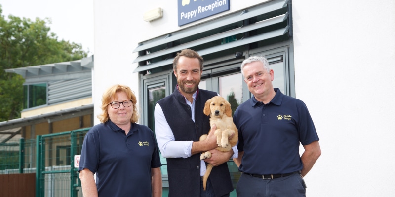 James Middleton At guide dogs UK, holding his donated puppy Bertie before he embarks on his journey to become a guide dog