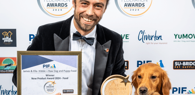 James Middleton and golden retriever holding PIF award