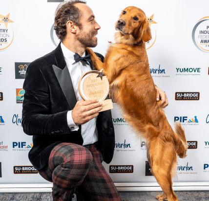 James middleton and golden retirever isla holding new product award at the PIF awards 2024