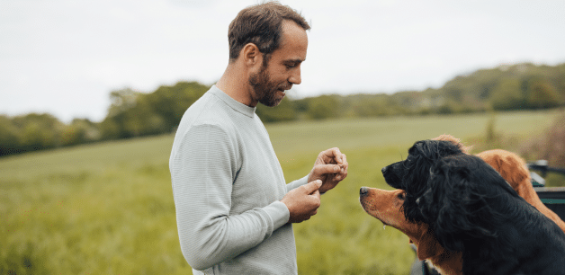 james middleton offering his dogs a hypoallergenic treat