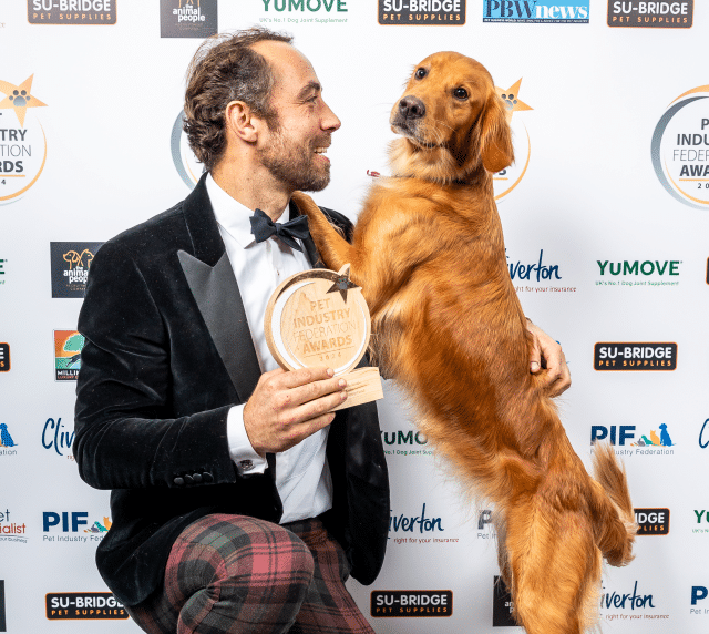 James Middleton with golden retriever Isla holding new product of the year award for Kibble + Raw food