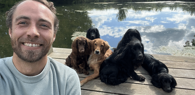 james middleton selfie with dogs in background next to water on a hot day