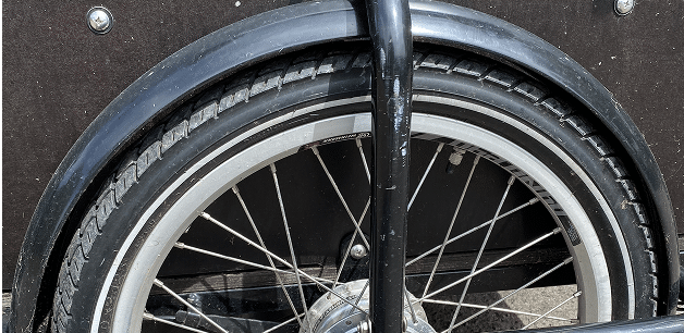 close up of a dog cargo bike wheel